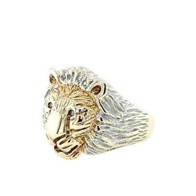 Gold lion head ring on a white background