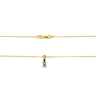 Gold necklace with a diamond pendant on a white background