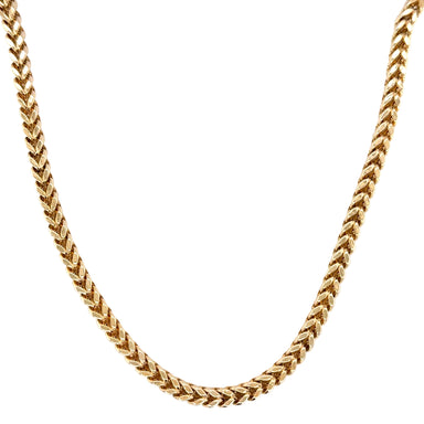 Gold chain necklace on a white background