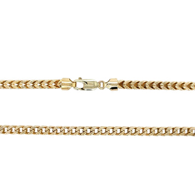Gold chain necklace on a white background
