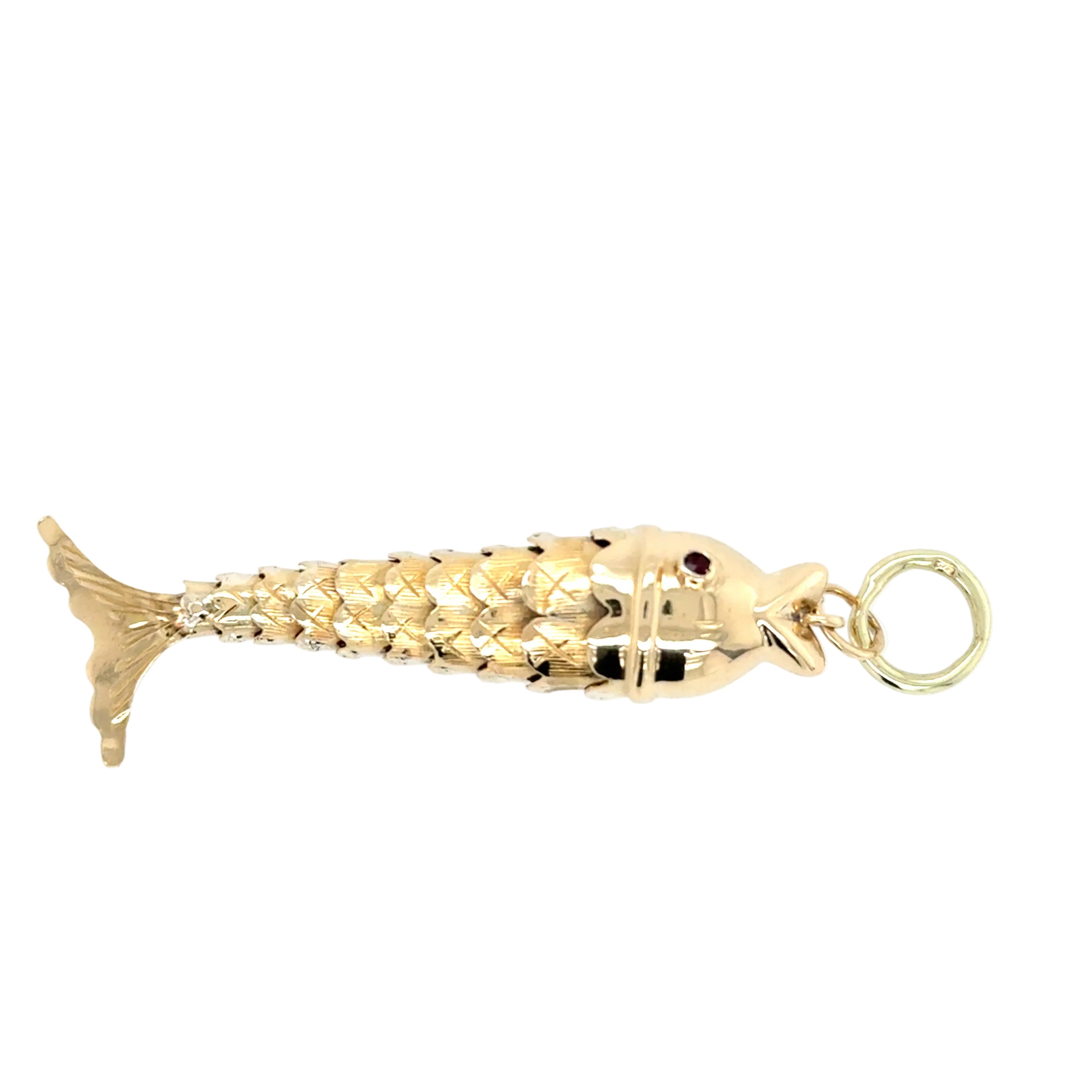 Gold fish-shaped pendant on a white background