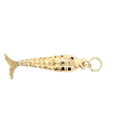 Gold fish-shaped pendant on a white background
