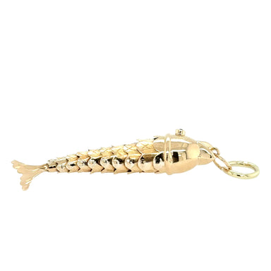 Gold fish-shaped pendant on a white background