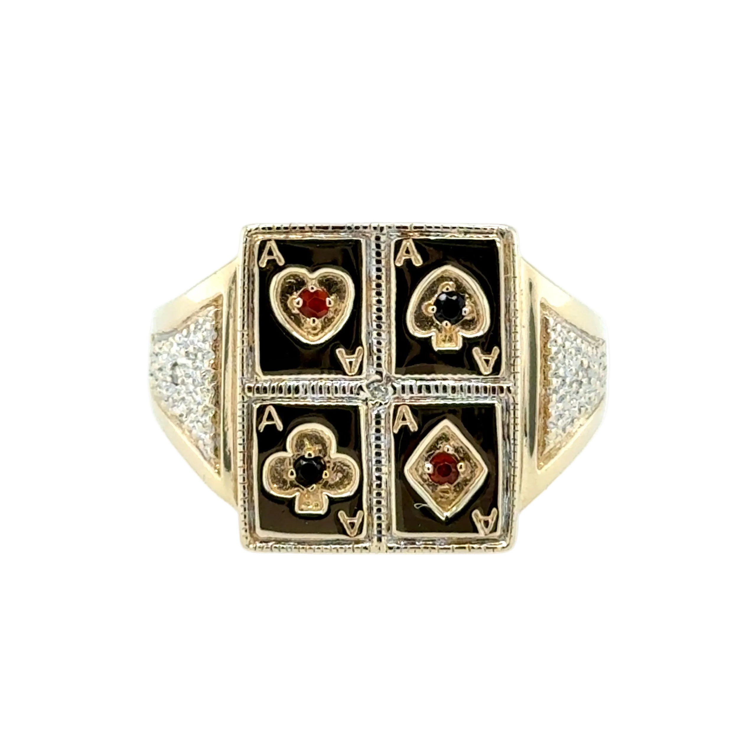 Gold ring with playing card suits design on a white background